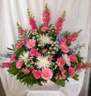 Large pink and white floral arrangement with gerbera daisies and carnations