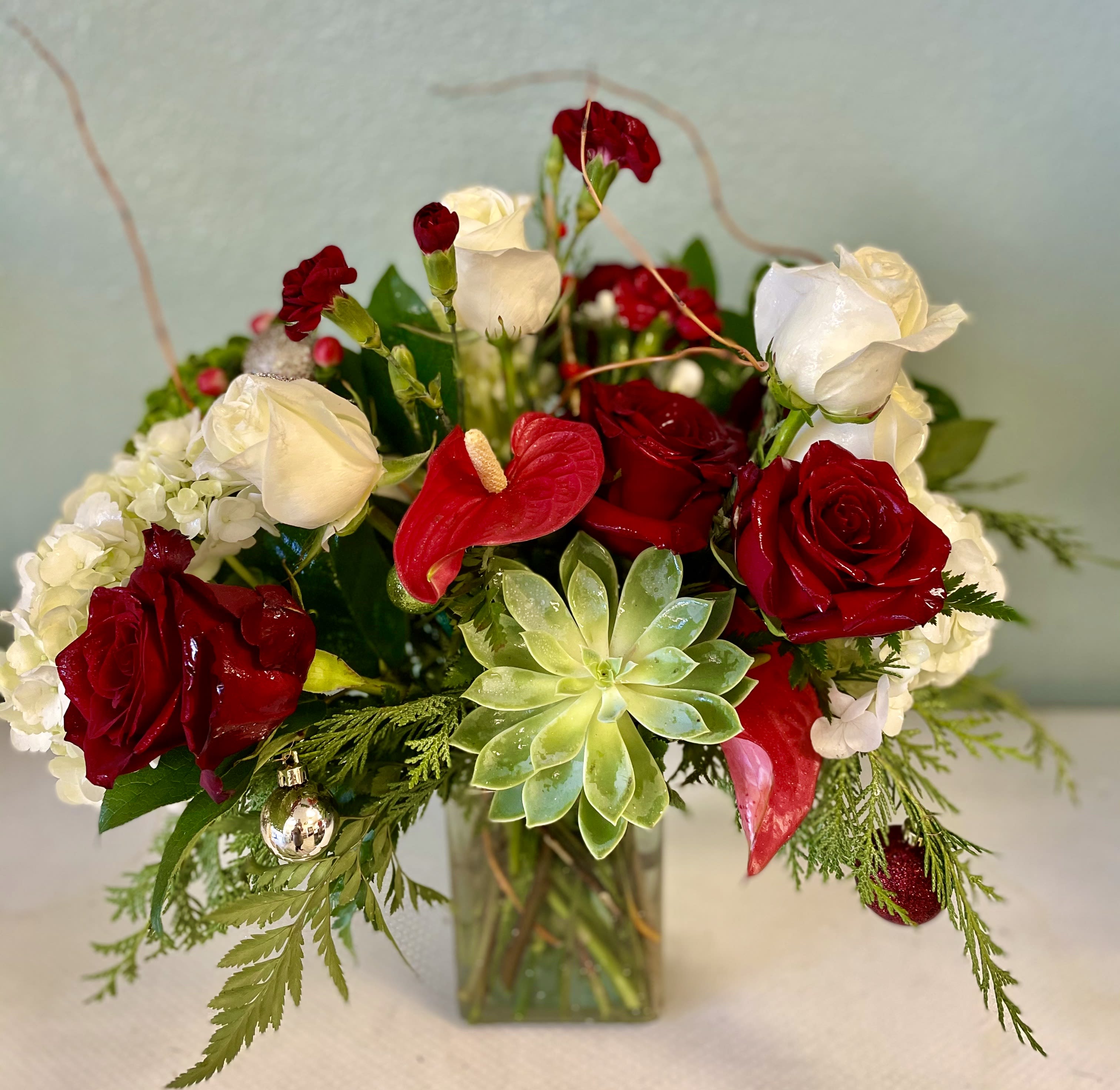 Hats off Southwest  - This is a South West Style Christmas arrangement; great for our area and Very Classy!! Great for a professional office setting!  