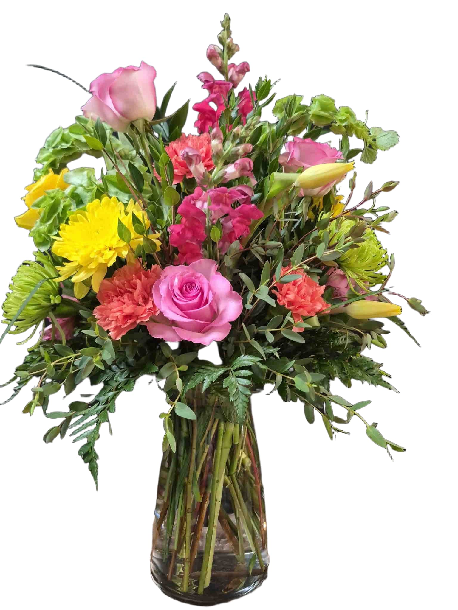 Summer Breeze - Full, garden-style mix of pink and yellow roses, yellow cremons, orange carnations, snapdragons, and tulips in a clear vase.