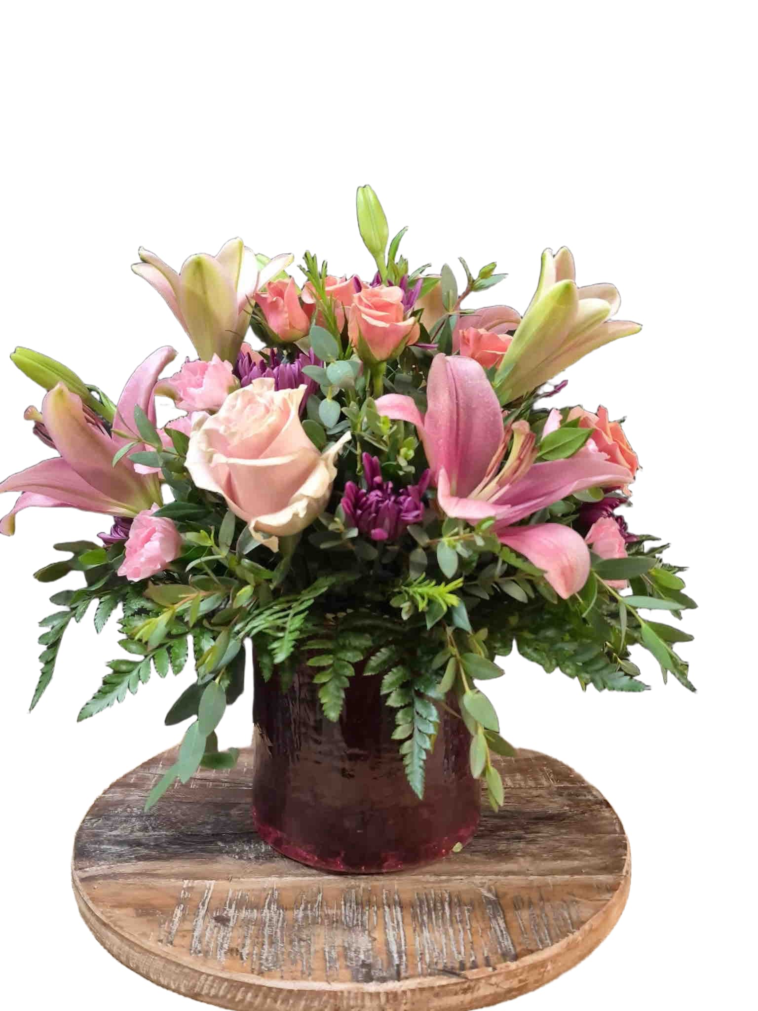 Stylish Romance Bouquet - Stylish spring bouquet with pink lilies, roses, carnations, purple mums and mixed greenery in a glass vase.