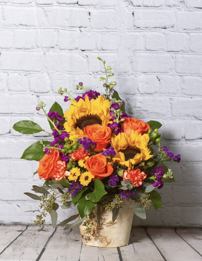 A Little Bit of Summer - All the bright and warm, vibrant colors of summer in one great arrangement! Includes roses and  sunflowers.