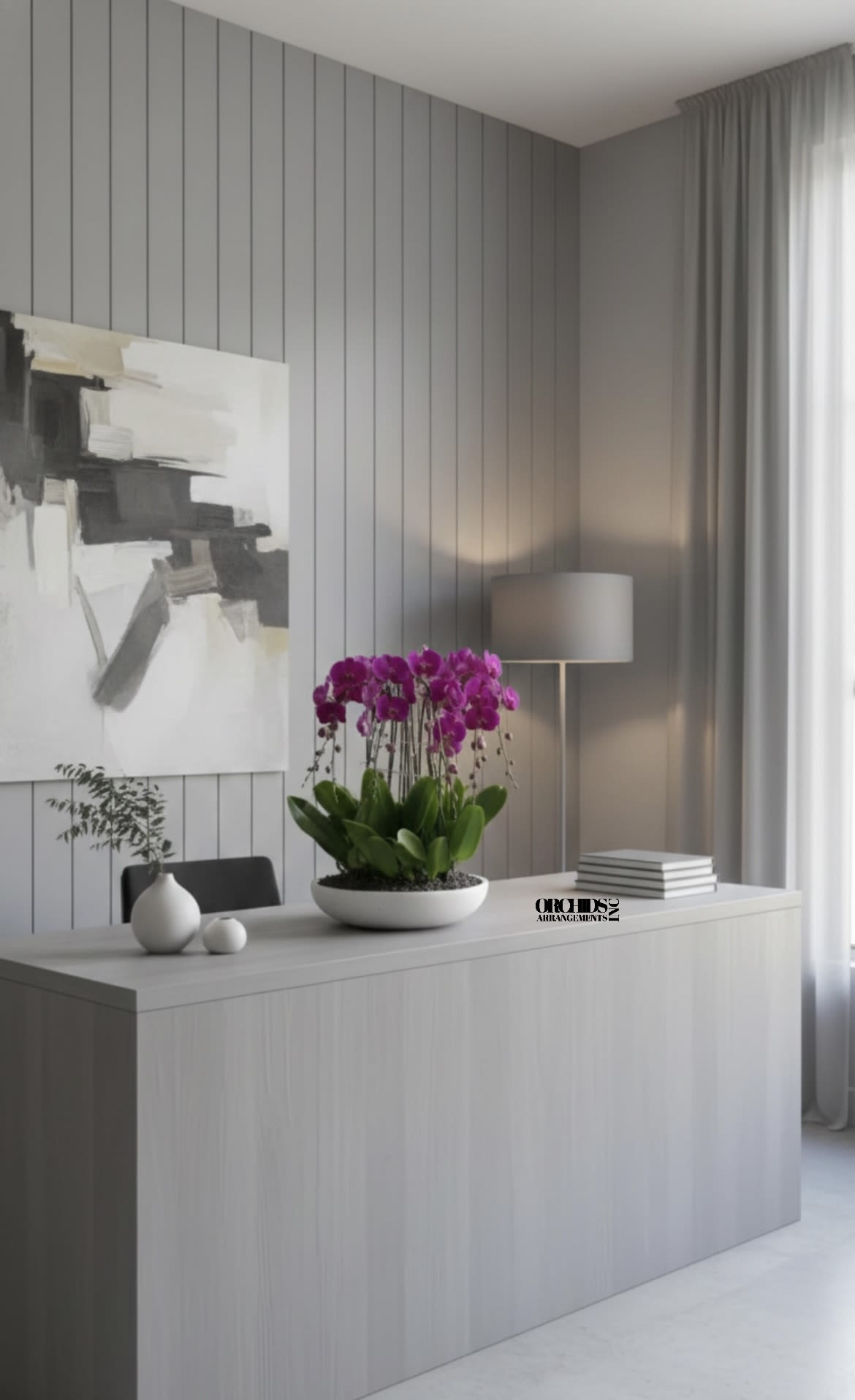 Potted purple orchids in a white bowl on a desk