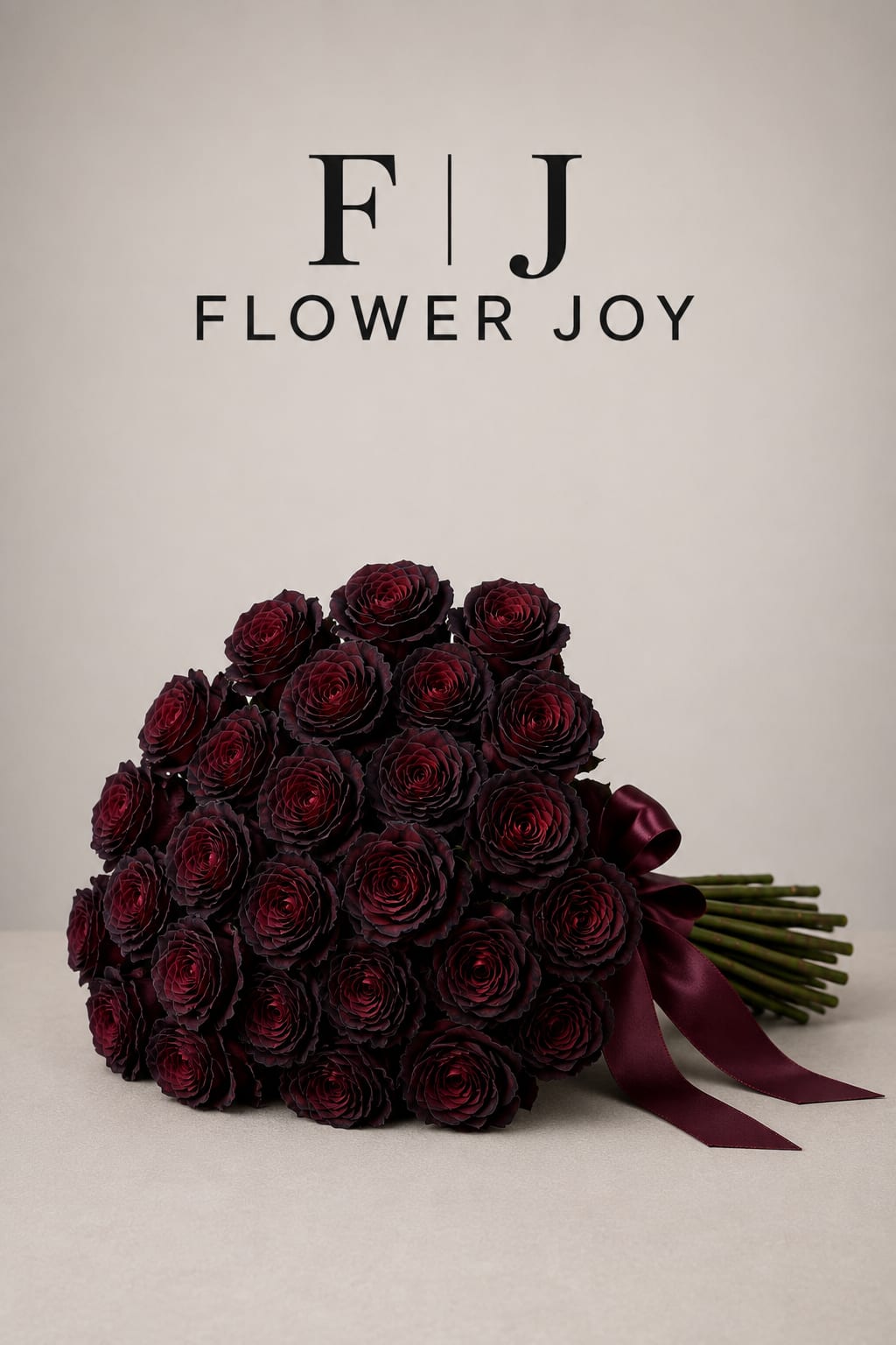 Midnight Romance Bouquet - A dramatic arrangement of 50 deep burgundy roses, hand-tied with an elegant satin ribbon. Rich, luxurious, and unforgettable, perfect for romantic celebrations, anniversaries, or a truly meaningful surprise.