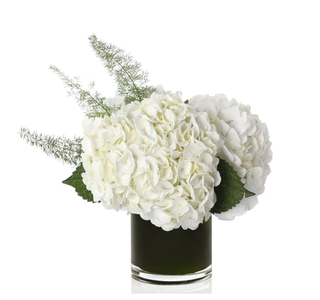 White hydrangea arrangement in a dark glass vase