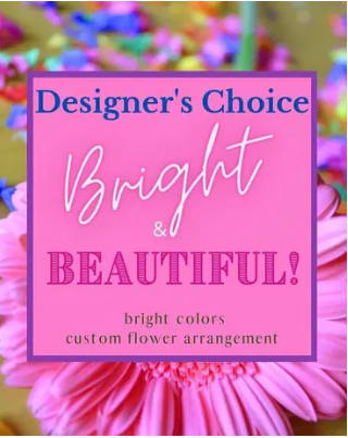 Pink flower arrangement with a designer's choice sign
