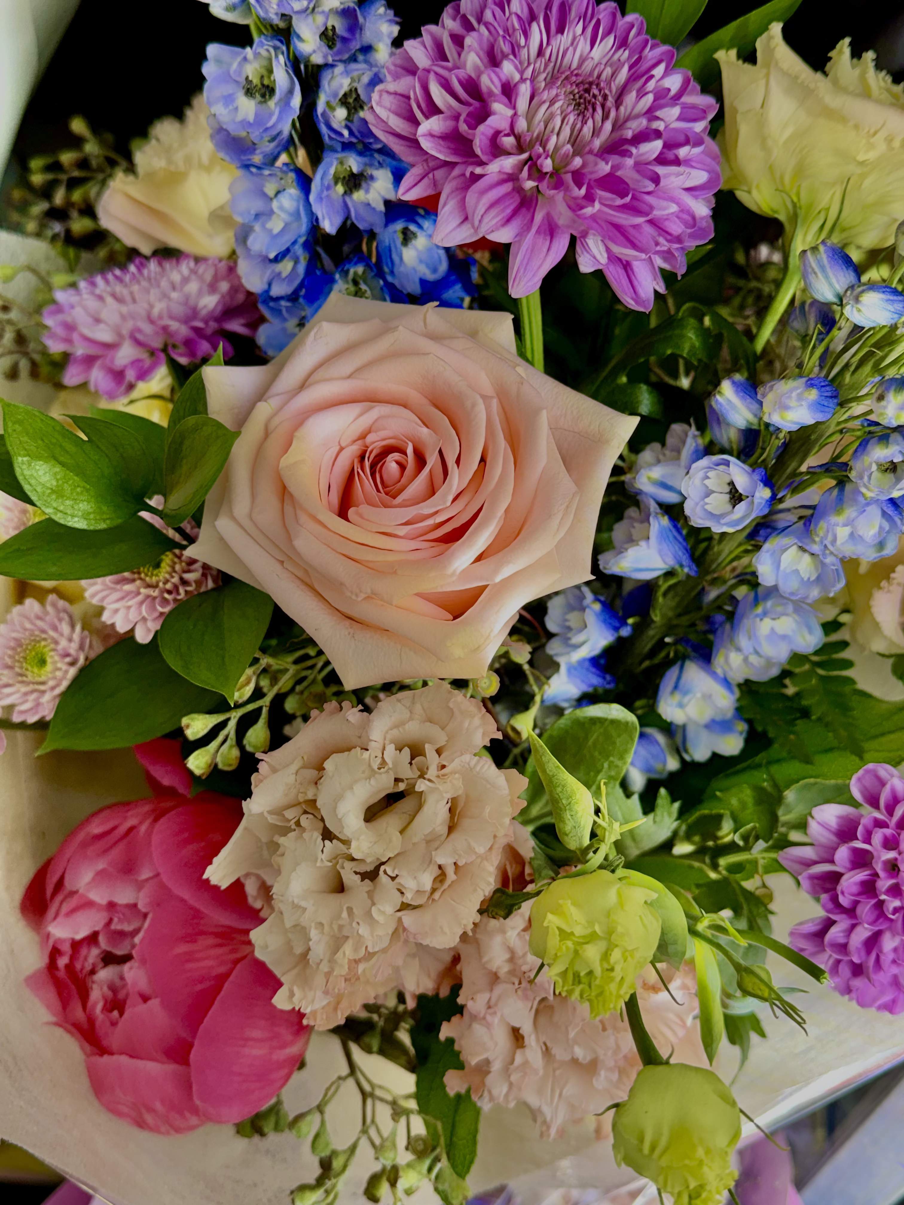 Florist choice wrapped bouquet  - Let our designers create a one-of-a-kind bouquet using the freshest seasonal flowers available. Each arrangement is uniquely crafted with a lovely mix of blooms and colors.  When upgrading to deluxe or premium they will receive additional flowers and more premium blooms for a more lush style and impressive presentation; perfect for birthdays, anniversaries, or any special celebration. May you have any special request like colors or flowers feel free to leave them in the notes, we will try our best to accommodate within reason.  