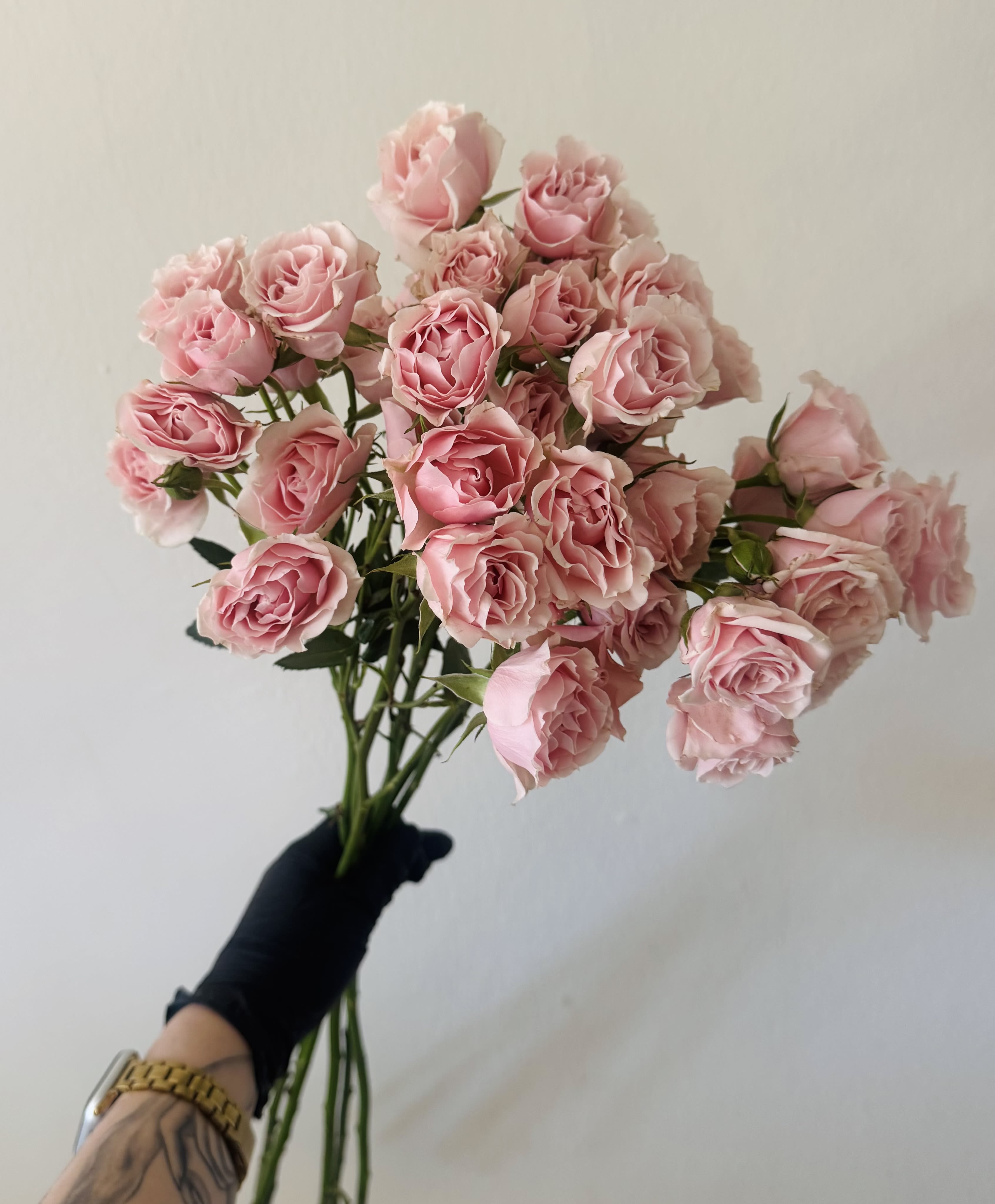 Mini roses bunch -   A fresh bunch of charming spray roses wrapped in simple kraft paper for a natural, effortless look. These delicate blooms feature multiple flowers on each stem, creating a full and romantic appearance that’s perfect for any vase. Enjoy them as they are or get creative and arrange them at home. More flowers. Less packaging. Beautiful everyday blooms at an accessible price.