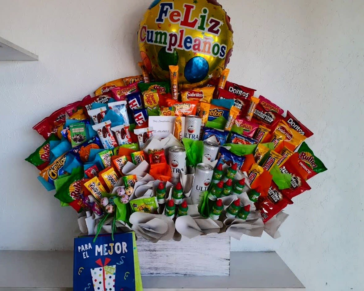 Ultimate Birthday Snack Celebration Box - Celebrate birthdays in a fun and unforgettable way with our Ultimate Birthday Snack Celebration Box from Snyder Flowers in San Antonio, Texas. This oversized birthday gift basket is filled with popular snacks, chocolates, candies, chips, beverages, and festive treats, making it the perfect surprise for kids, teens, friends, coworkers, family members, and loved ones. Ideal for birthdays, congratulations, graduations, thank-you gifts, office celebrations, and special occasions. We proudly offer same-day gift delivery throughout San Antonio, Stone Oak, Alamo Heights, The Dominion, Medical Center, Helotes, Schertz, Cibolo, Bulverde, and surrounding communities. Custom gift baskets and personalized gift boxes are available for every celebration.