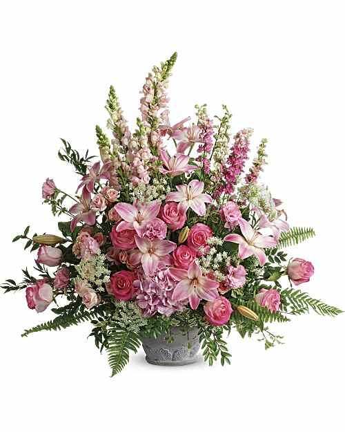 Graceful Glory Bouquet - An exuberant celebration of a beautiful life, this glorious bouquet of pink hydrangea, roses and lilies adds feminine grace to the service. Light pink hydrangea, pink roses, light pink spray roses, light pink asiatic lilies, pink lisianthus, pink larkspur, light pink snapdragons, and Queen Anne's lace are arranged with Italian ruscus, huckleberry, pitta negra, sword fern, flat fern, and lemon leaf. Delivered in a Parisian Garden Pot.