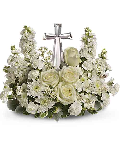 Divine Peace Bouquet - An elegant display of faith and divine peace, this beautiful arrangement will comfort the bereaved in a truly thoughtful and respectful way. An exquisite crystal cross is surrounded by a bed of lovely blossoms. It is sure to be appreciated and always remembered. A fragrant mix of pure white blooms - including roses, alstroemeria, stock, carnations and waxflower - is accented with dusty miller and variegated pittosporum around an exclusive Crystal Cross keepsake.