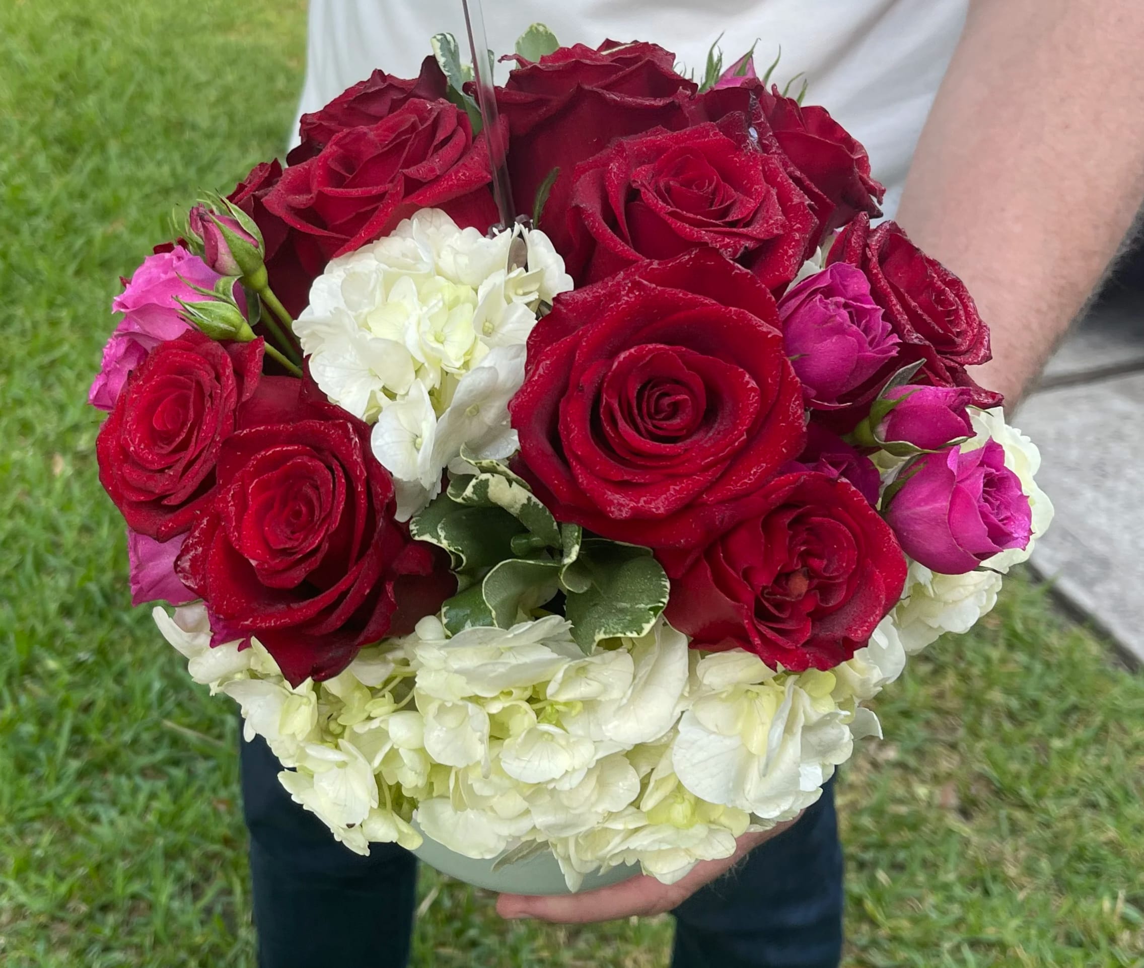 Bouquet of red roses with white hydrangeas and pink rosebuds