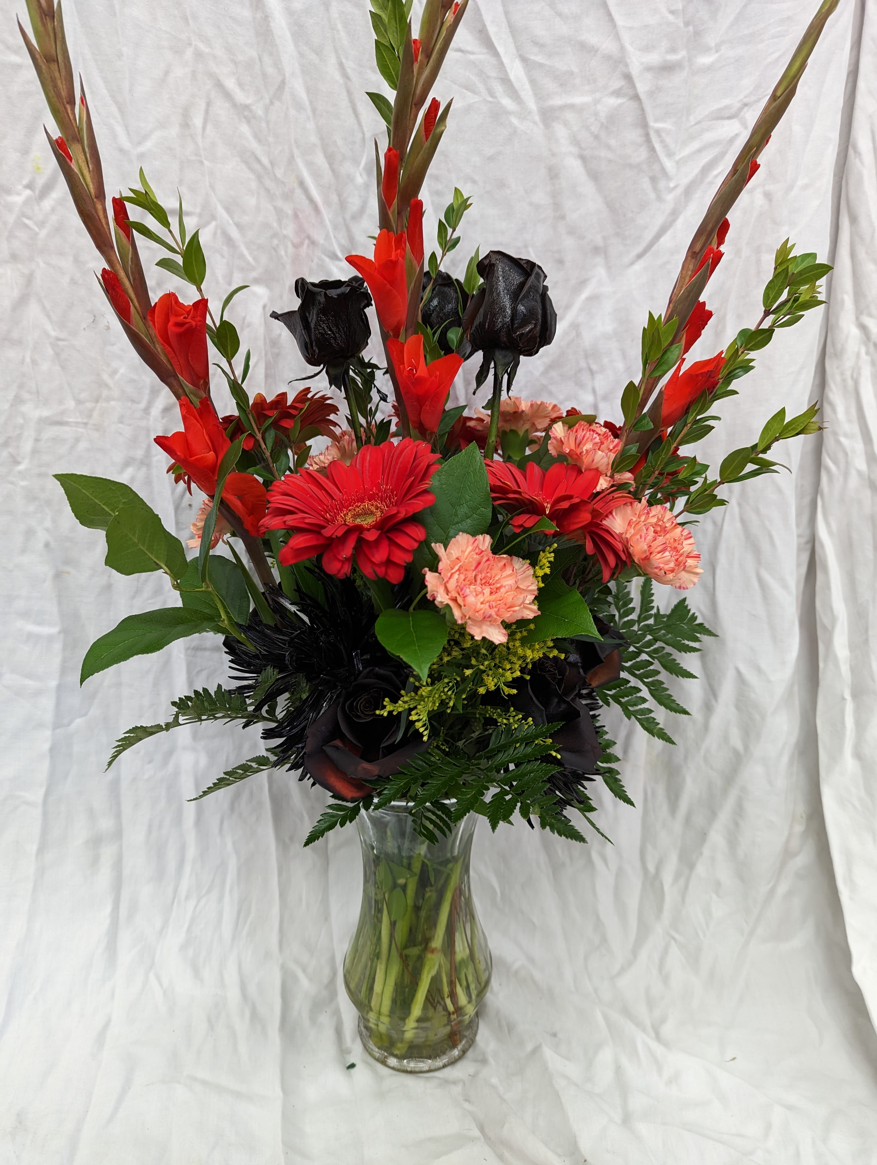 Memorial reception flowers - Orange and black flowers were requested for a Harley Davidson member's memorial service.
