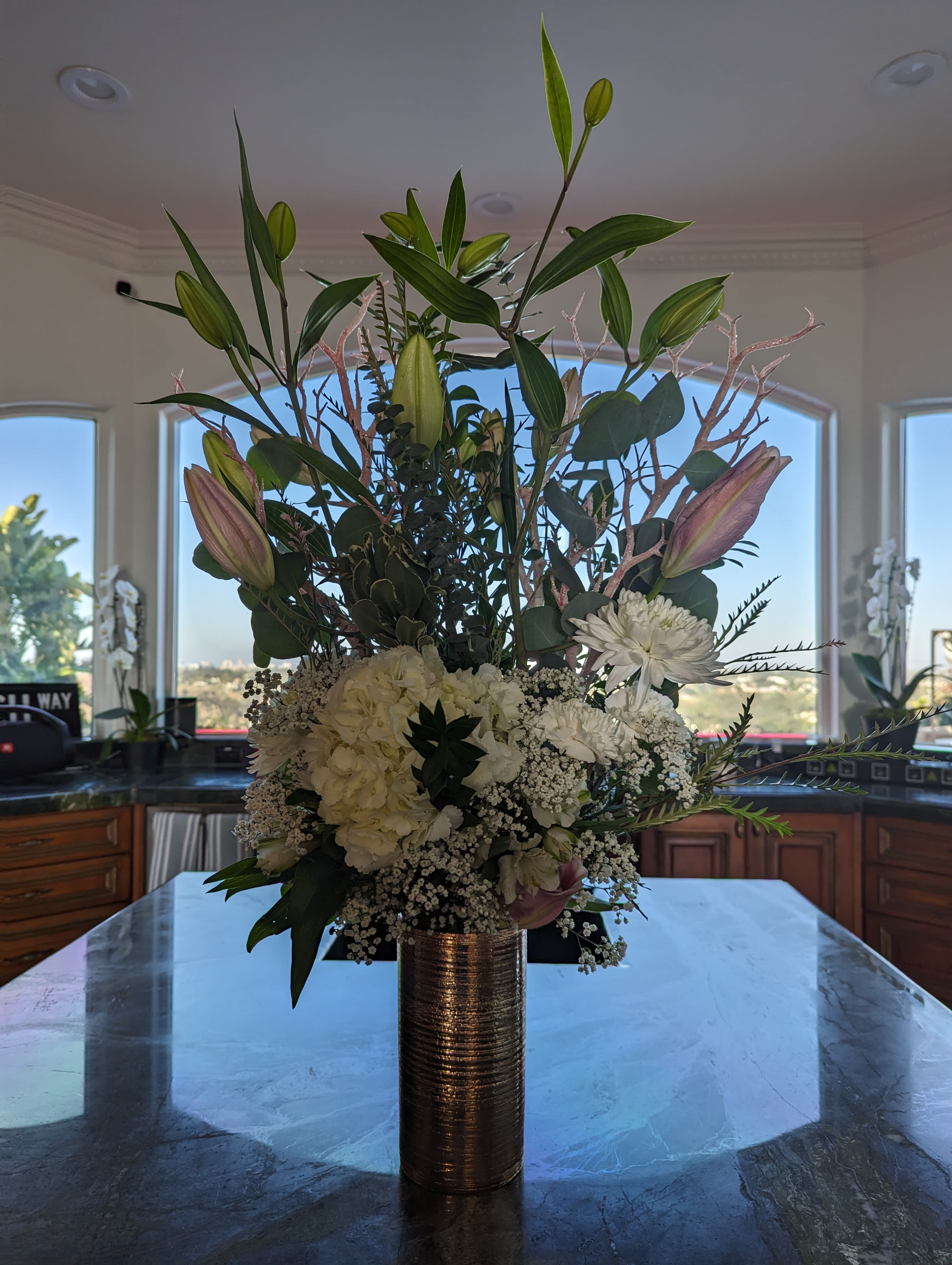Hydrangea and stargazer - Tall centerpiece to welcome your guest for dinner.