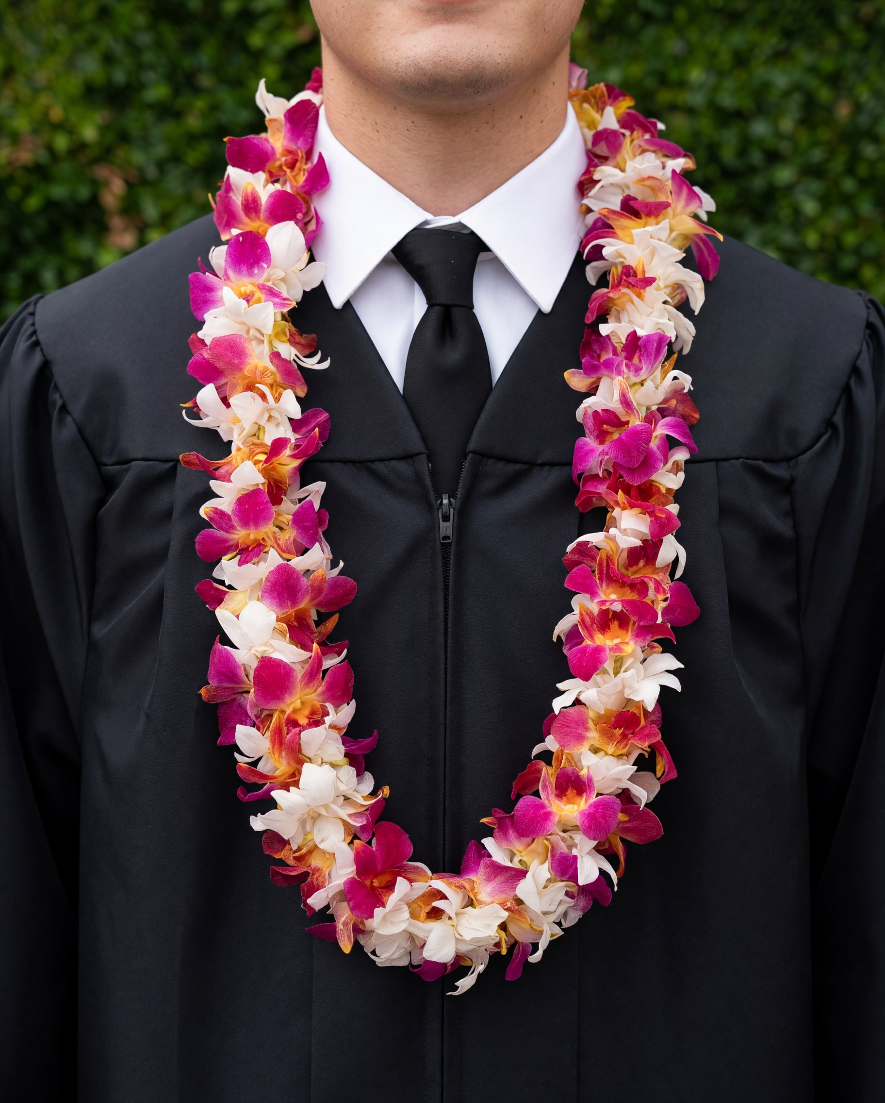 White and Red Double Lei - A double orchid lei beautifully mixed with hues of red, yellow, white. Perfect USC school colors.