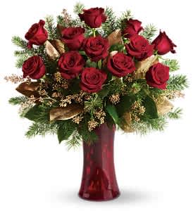 A Christmas Dozen - Dazzling and delightful. A dozen red roses make a dashing holiday gift, especially when they are arranged with brilliant holiday touches and delivered in a ruby red vase.  Twelve beautiful rose blossoms mix with salal, eucalyptus and golden fir branches in a radiantly red glass vase.  Approximately 22" W x 23 1/2" H  Orientation: One-Sided  As Shown : T115-2A Deluxe : T115-2B Premium : T115-2C