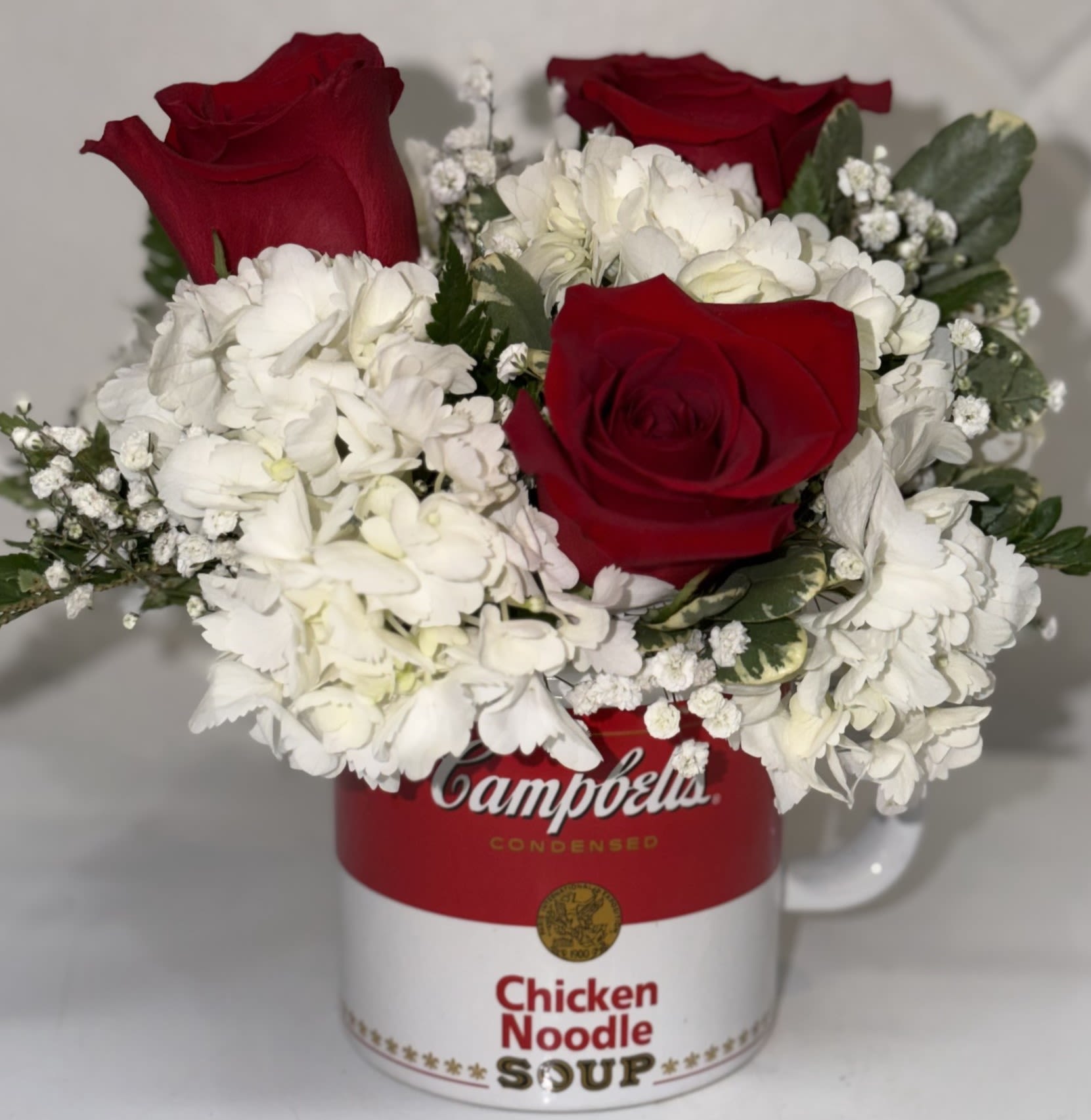 Campbell's® Healthy Wishes - Presented in a stylish Campbell's® Chicken Noodle Soup ceramic mug, this arrangement is not only a stunning gift idea but also a practical one. The recipient can enjoy their favorite beverage in this charming mug for years to come, reminding them of your thoughtful gesture. 