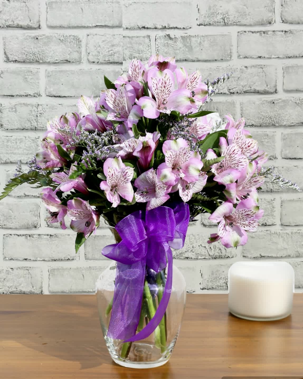 Oh So Lovely (Purple) FG207P - This pretty arrangement is made with long lasting alstroemeria.  Available in white, pink, purple or a combination of these colors.  Approximately 12"H and 10"W.