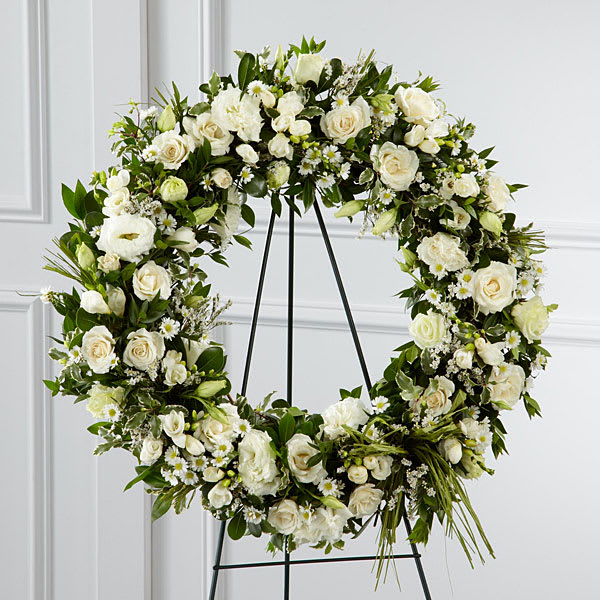  Splendor Wreath(FTD) - The FTD® Splendor™ Wreath is a symbol of lasting love and kinship whether for the deceased or in comfort of those suffering from a loss. Elegant white freesia double lisianthus spray roses monte casino asters and limonium are accented with a variety of lush greens and green raffia ribbon perfectly arranged in the form of a wreath to create a beautiful way to display your sincere sentiments.