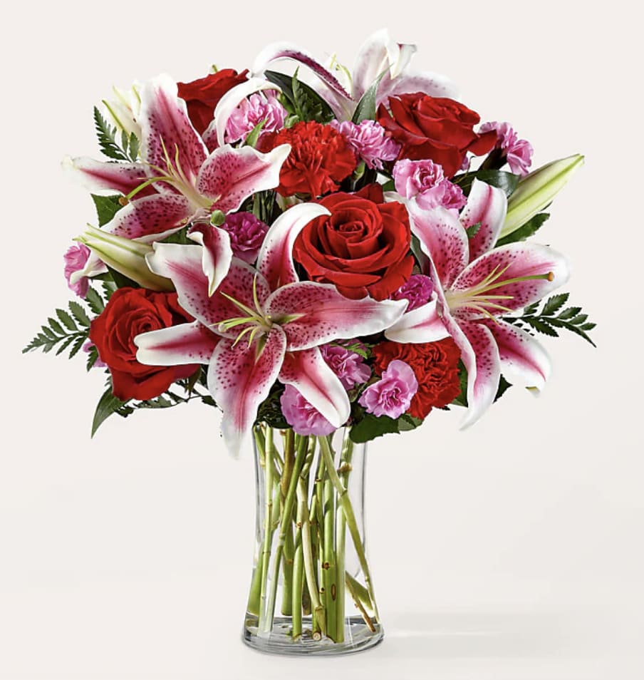 Love is in The Air  - Bouquet is composed of a lively combination of vibrant flowers that included roses and Stargazer lilies to celebrate any and every moment. 