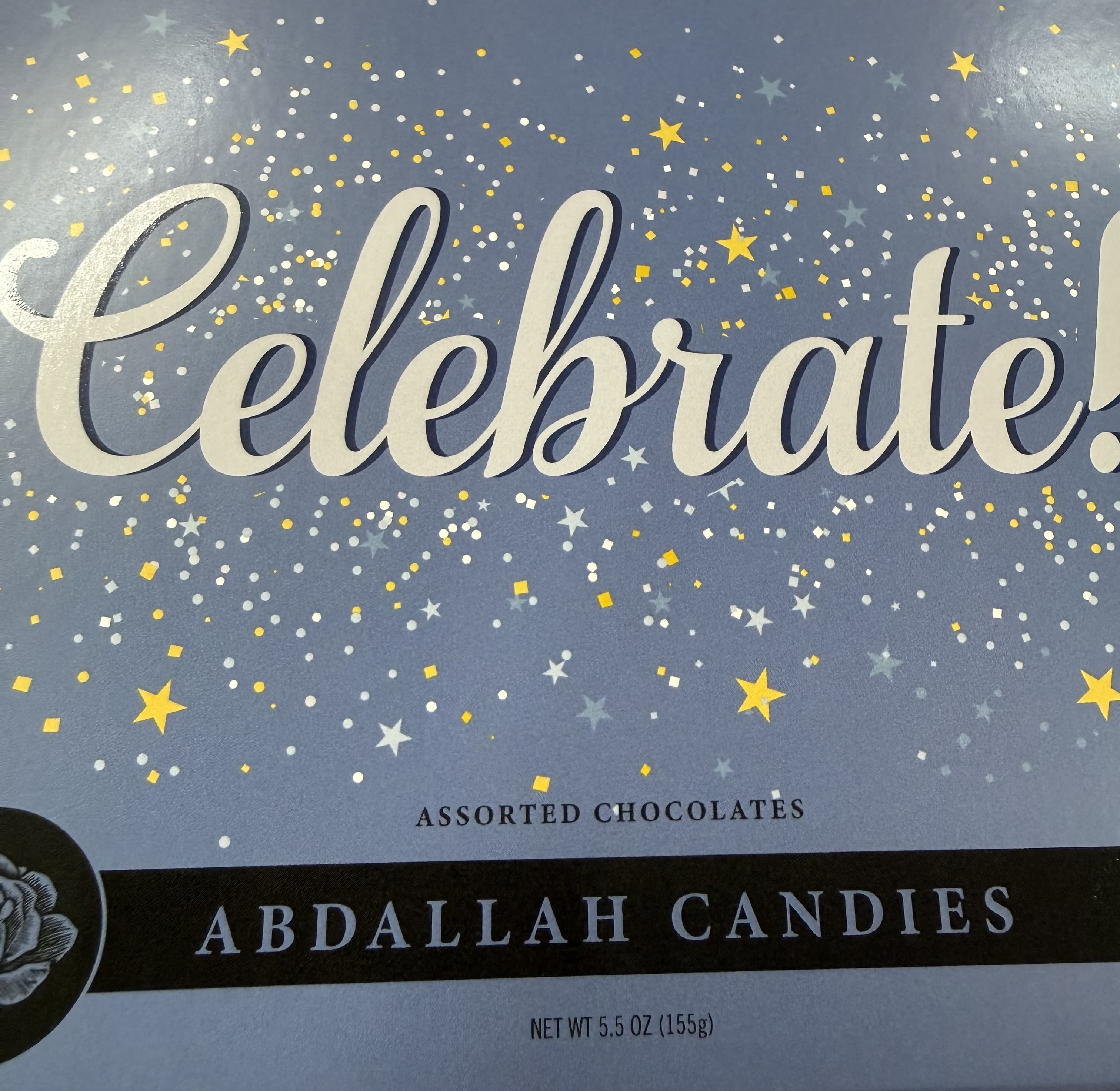 Abdallah Celebrate Chocolates - 5.5 oz box of Abdallah chocolates containing an assortment of sea salt caramels, raspberry creams, pecan caramels, double dark fudge, and butter almond toffee