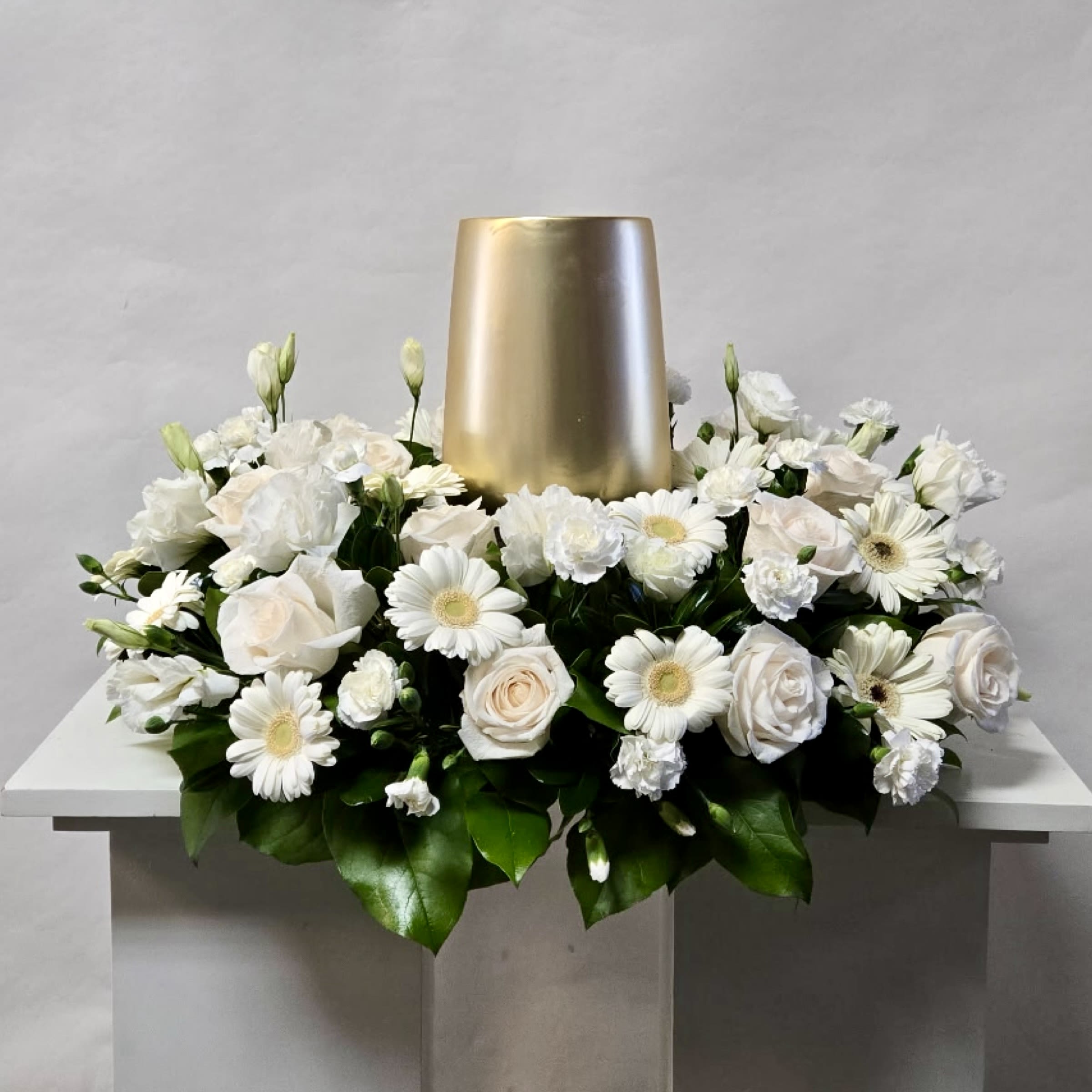 Peace and Comfort Urn Wreath - This Urn Wreath Includes White Roses, White Gerbera Daisies, and White Mini Carnations. Or as Similar as Possible. 