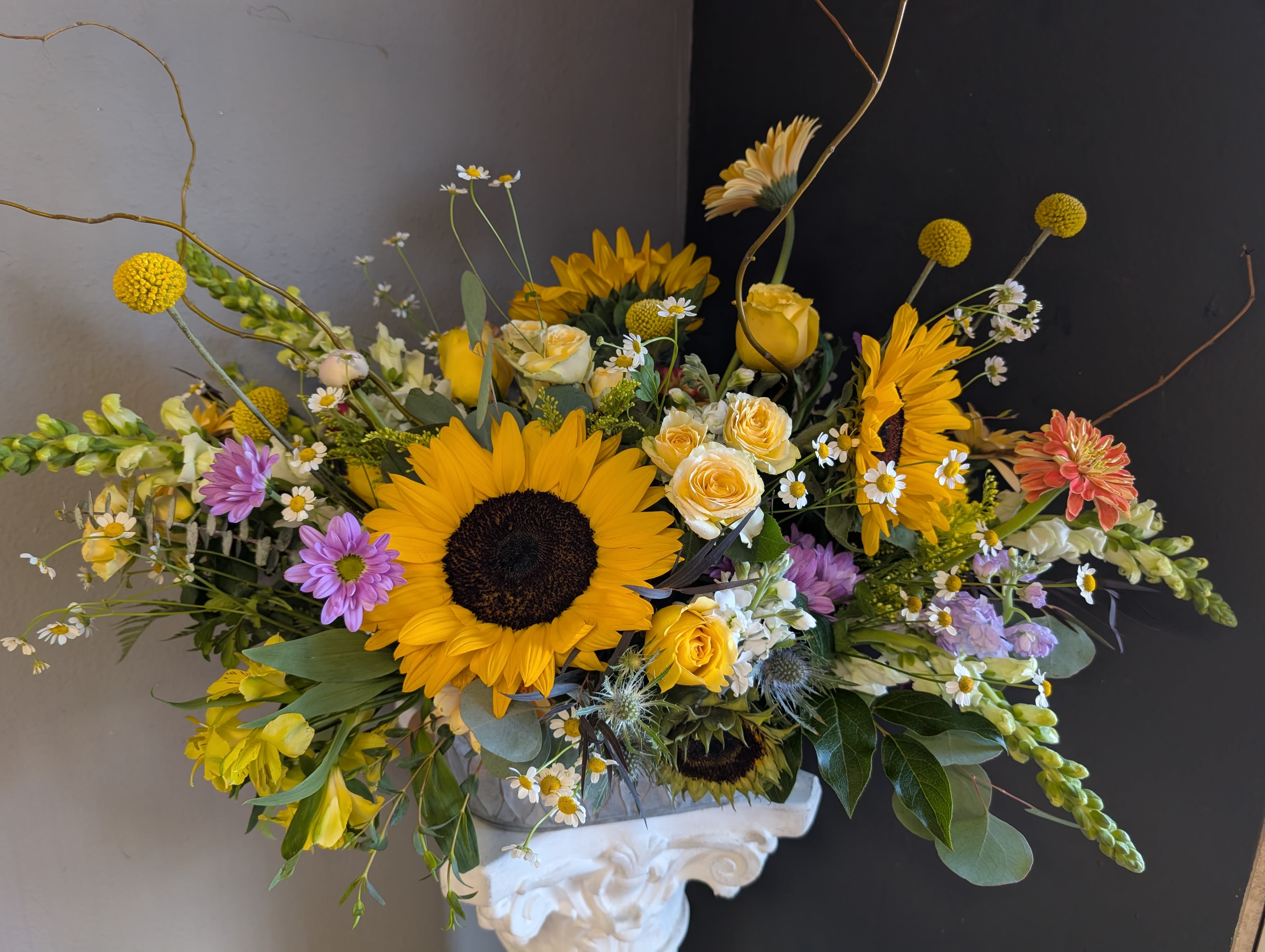 #736 Designer's Choice Vase Arrangement  - This beautiful flower arrangement of fresh mixed seasonal blooms is made by local designers in the heart of Orange California. Hand crafted and perfect for every occasion, from birthdays and new babies to sympathy and just because. The best choice to show you are thinking of that special someone. Can be sent as a local delivery or in-store pickup. This is an original, one of a kind arrangement. Order now before it's too late!  UPGRADES: All upgrades are applied at the designer’s discretion and fulfilled to value using the freshest seasonal and/or premium flowers available. Container upgrades may be included when possible; otherwise, value is reflected in the floral selection while maintaining the original design style. 