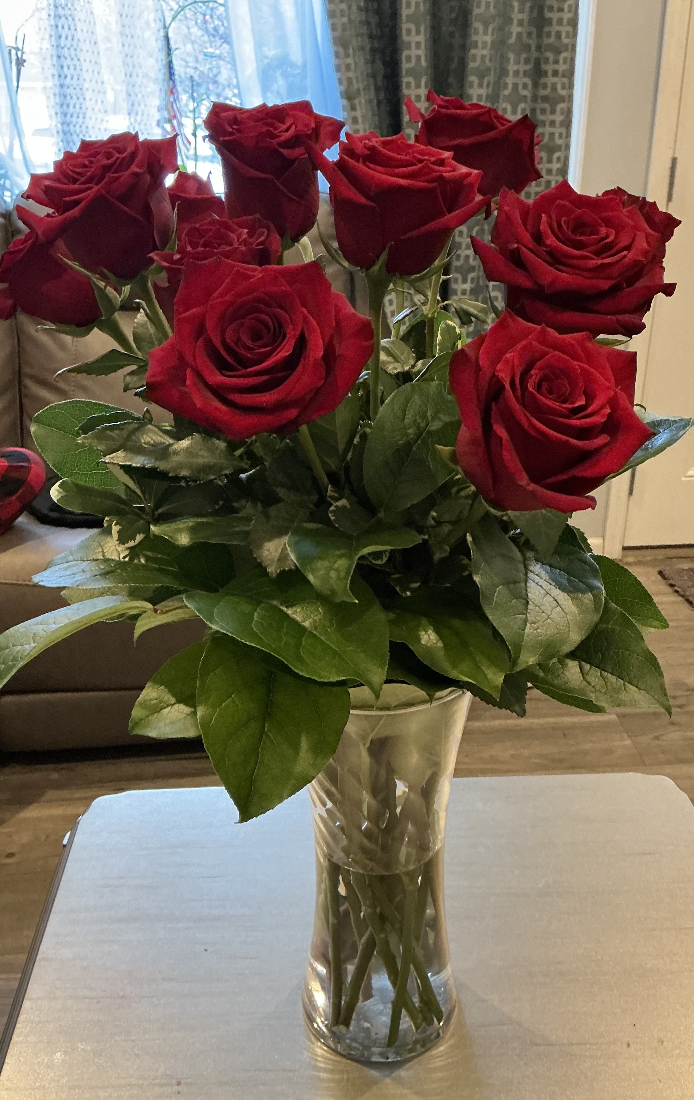 Bouquet of red roses in a clear glass vase