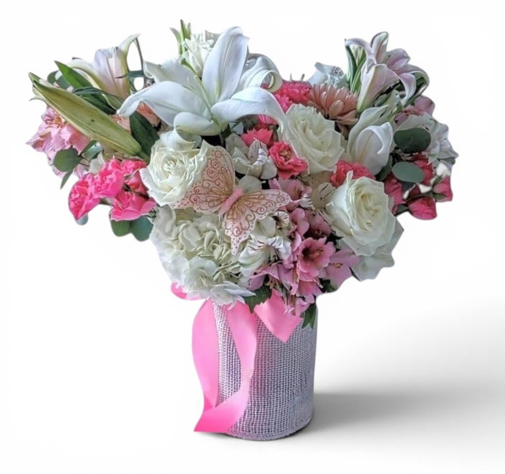 Feminine Fragrant Bella Beautiful Bouquet Designer's Choice - This design is intended for home delivery only. Not for services. Lovely roses orchids and so much more arranged in a tall modern glass cylinder vase wrapped in beautiful white jute ribbon. Perfect to send for every occasion to show them how much you care. All fresh flower bouquets that leave my flower shop studio are beautiful one of a kind works of art made special and unique each time. Please visit my beautiful gallery to see my latest designs that I have created for my online customers. Send them happiness today.
