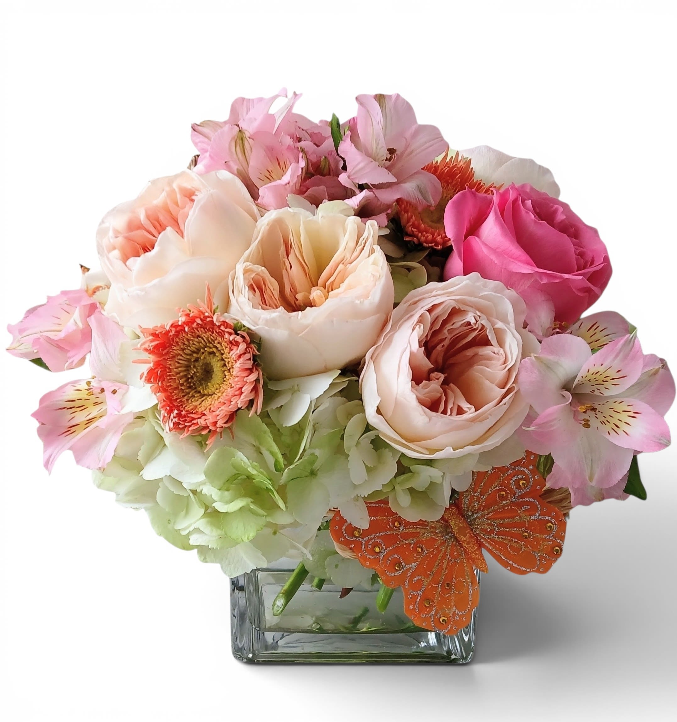 Get Well Real Soon Bouquet Designer's Choice - Send this cheerful bouquet today to let them know how much you care with it's peach blossoms of the day roses hydrangeas and more arranged in a modern glass cube vase. Perfect to send for wishing them a speedy recovery. Always made extra special and unique each time. Send them well wishes.