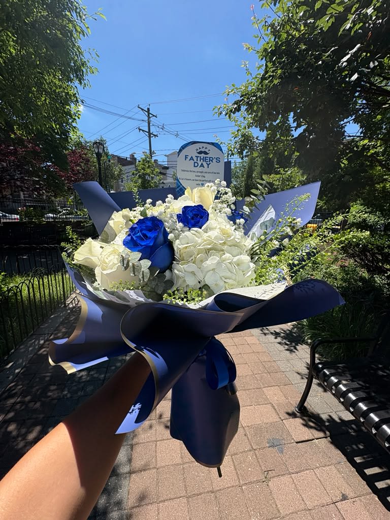  Blue Legacy Bouquet - Celebrate Dad with the timeless beauty of the Blue Legacy Bouquet. Featuring premium blue and white roses, lush white hydrangeas, delicate fillers, fresh greenery, and luxurious Korean wrapping, this arrangement symbolizes strength, wisdom, loyalty, and unconditional love. A sophisticated gift designed to honor the man who has always been there.