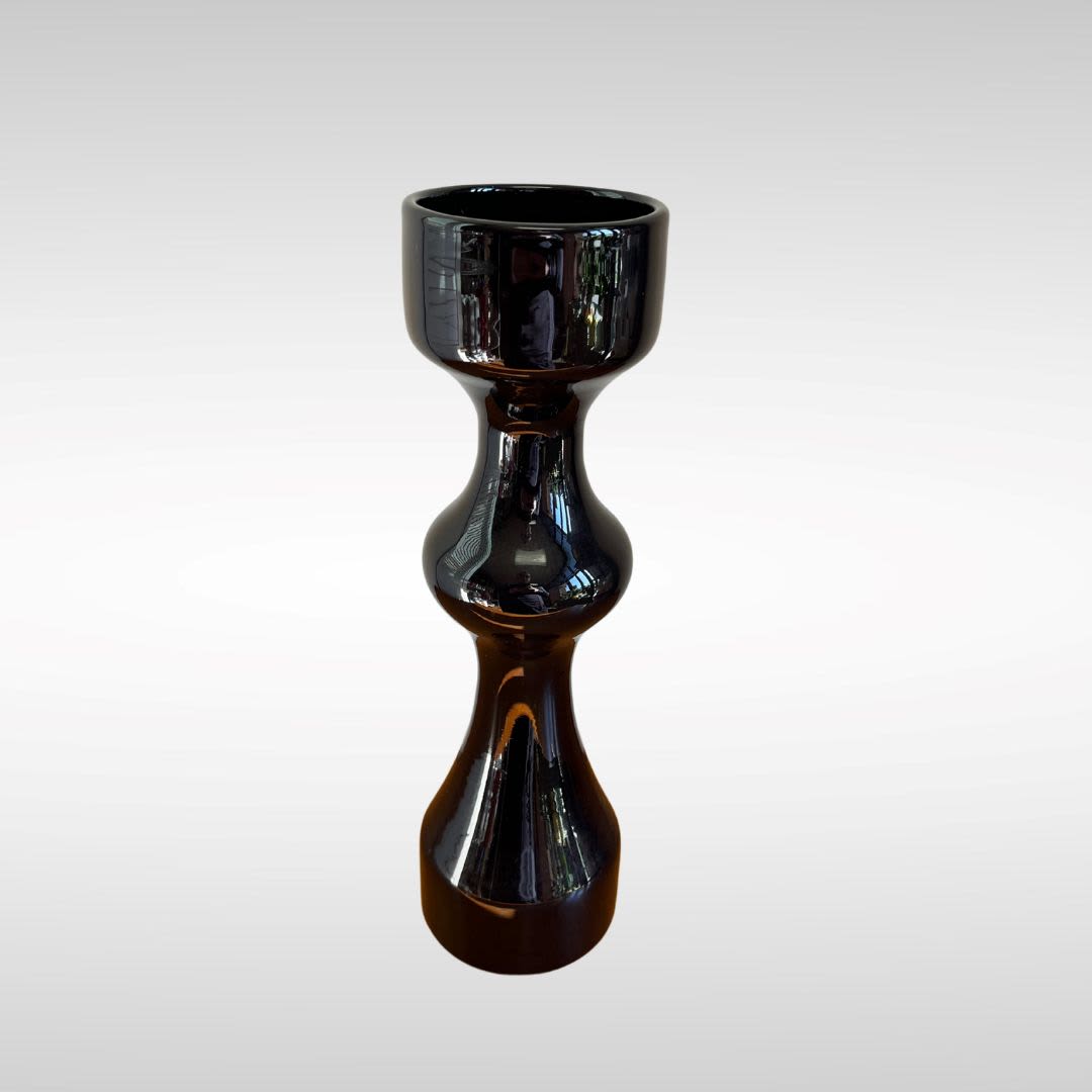 Black glossy decorative candle holder on a white background