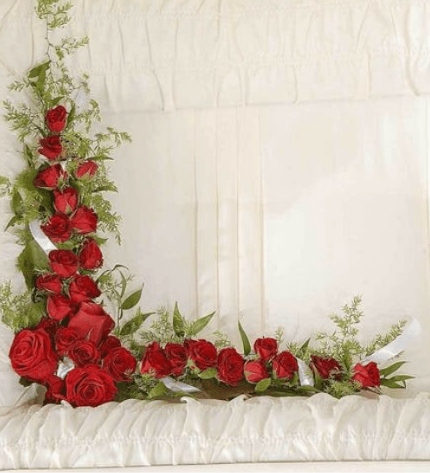 Corner of My Heart Casket Arrangement - This arrangement is a red rose casket lid corner insert, meant to provide a final touch of beauty and comfort during the viewing. Colors can be substituted upon request.