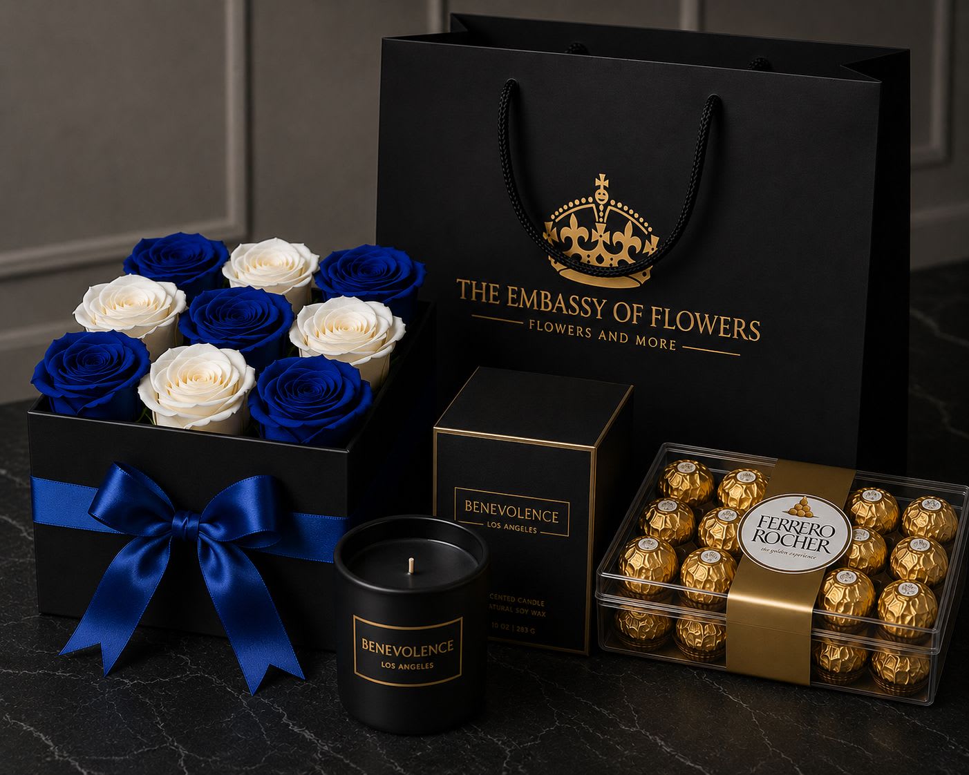 Royal Indulgence Gift Set - xperience the art of luxurious gifting with our Royal Sapphire Gift Set, an exclusive collection thoughtfully designed to impress and delight. This sophisticated arrangement features 12 premium fresh blue and white roses beautifully presented in an elegant black keepsake box adorned with a royal blue satin ribbon.  Complementing the floral arrangement is a box of decadent Ferrero Rocher chocolates and the exquisite Benevolence LA Premium Rose &amp; Sandalwood Scented Candle, whose delicate blend of romantic rose and warm sandalwood creates an atmosphere of comfort, elegance, and tranquility.  Presented inside our signature black paper gift bag with gold accents, this collection delivers more than a gift—it creates a truly memorable experience. From the moment it arrives, its majestic presentation transforms a beautiful gesture into an unforgettable expression of love, appreciation, and sophistication.