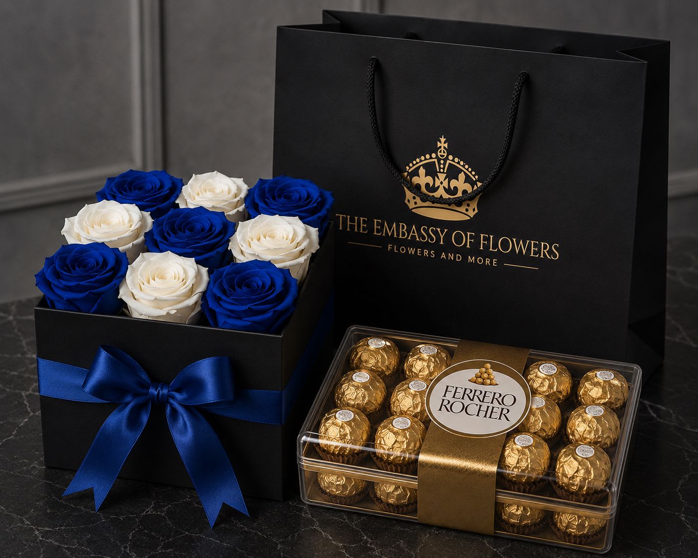 Royal Sapphire &amp; Chocolate Collection - Indulge in timeless elegance with our Royal Sapphire &amp; Chocolate Collection, a luxurious gift designed to impress from the very first glance. This exquisite arrangement features twelve premium fresh roses beautifully presented in a sophisticated black keepsake box adorned with a royal blue satin ribbon and accompanied by a decadent box of Ferrero Rocher chocolates.  To complete the experience, every arrangement arrives inside our signature black paper gift bag with gold accents, creating a majestic presentation that transforms a thoughtful gesture into an unforgettable experience.  Includes: 12 premium fresh roses Luxury black keepsake box with royal blue satin ribbon Box of Ferrero Rocher chocolates Signature black paper gift bag Complimentary message card Color Options:  Customize your arrangement to suit any occasion. Roses are available in:   All Blue Roses  All White Roses  Blue and White Roses (as shown in the picture)  Please note that flower colors may be customized based on availability and customer preference.   More than just a gift, the Royal Sapphire &amp; Chocolate Collection is designed to deliver a luxurious and memorable experience that will be cherished long after it is received.