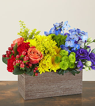 Color of Love - This bouquet is all about capturing the color of your unique love. With a rainbow color pallete, this arrangement has everything from bold reds to vibrant violets, and the all gorgeous hues in between! Our Color of Love Bouquet is made up of a wide array of blooming beauties like carnations, roses, button pompons and more.