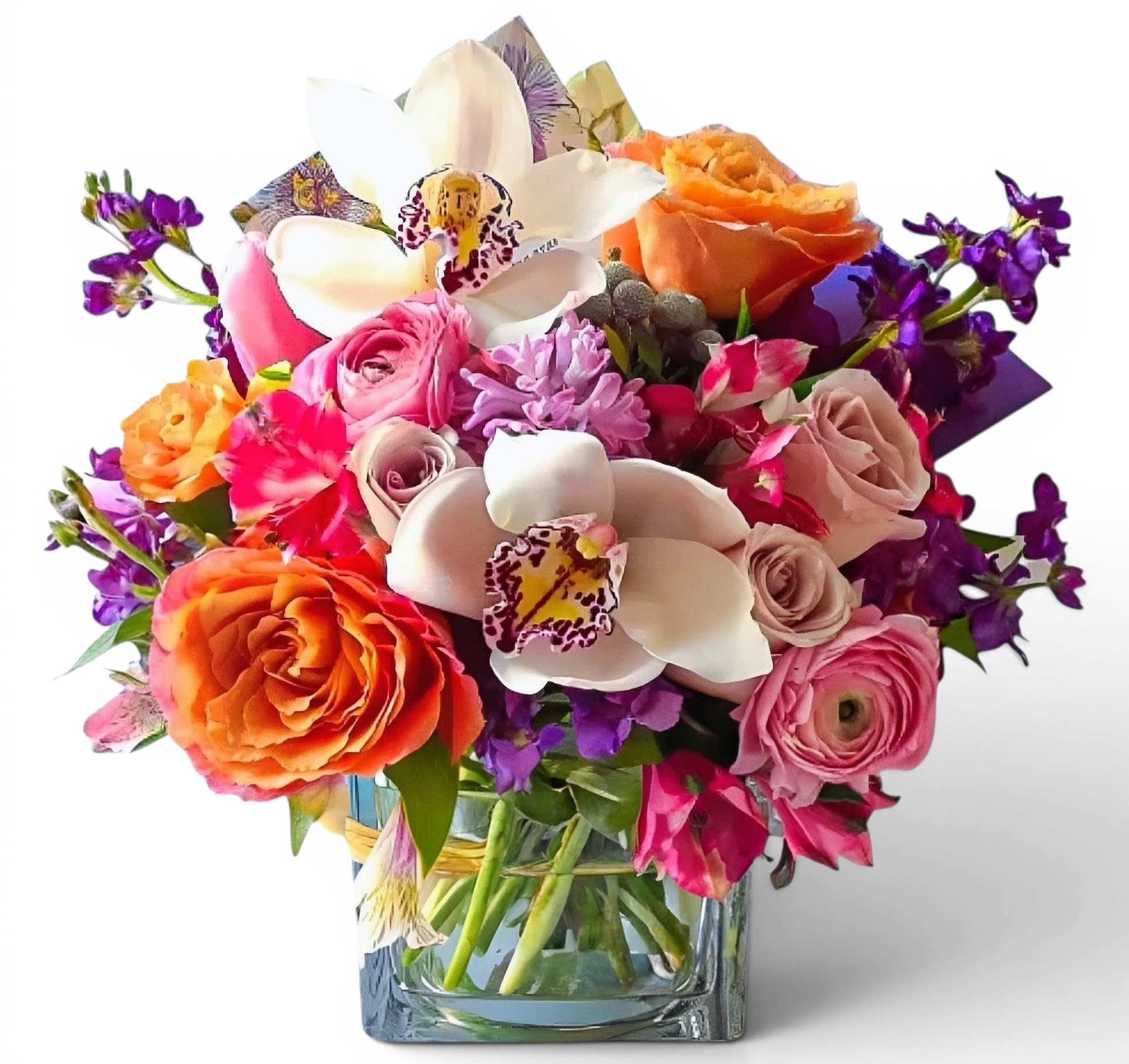 Mixed bouquet with roses, orchids, and purple flowers in a glass vase