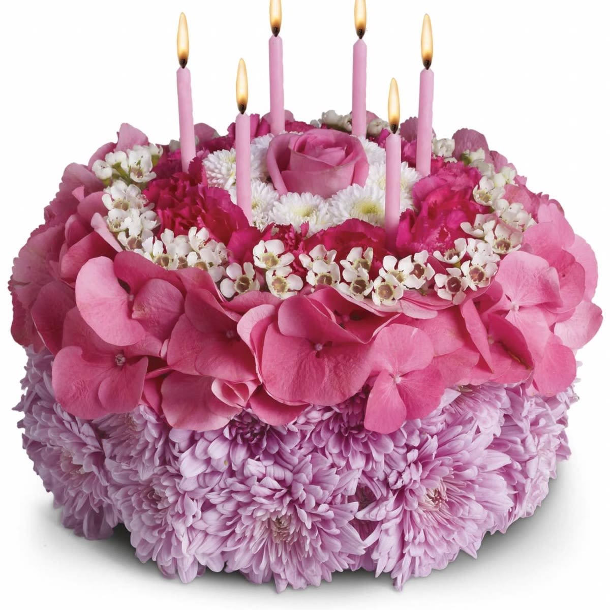 Blooming Birthday Cake Arrangement - A delightful floral arrangement designed to look like a festive birthday cake! This charming creation features layers of vibrant red carnations, cheerful white daisies, green button mums, and a soft blush pink rose centerpiece, accented with decorative birthday candles. Perfect for sending birthday wishes in a unique and memorable way.