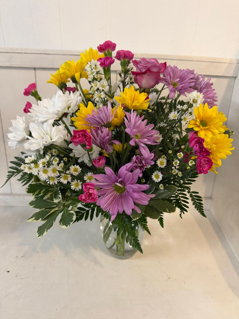 OH HAPPY DAYS - THIS IS A HAPPY ARRANGEMENT GREAT FOR ANY OCCASION. FILLED WITH LONG LASTING FLOWERS, CARNATIONS, FILLER, A ROSE,  MINI CARNATIONS. COLORS MAY VARY FOR THE BEST AND FRESHEST FLOWERS.