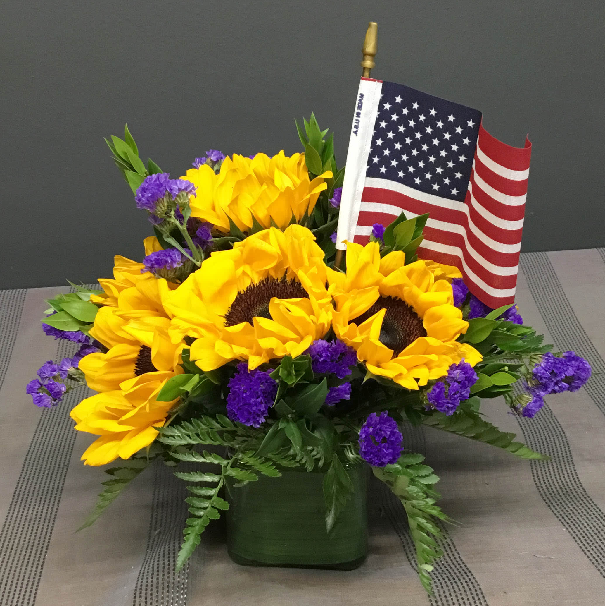 Happy 4th! - Happy 4th of July! with Sunflowers, Statice and Greens with a Flag.