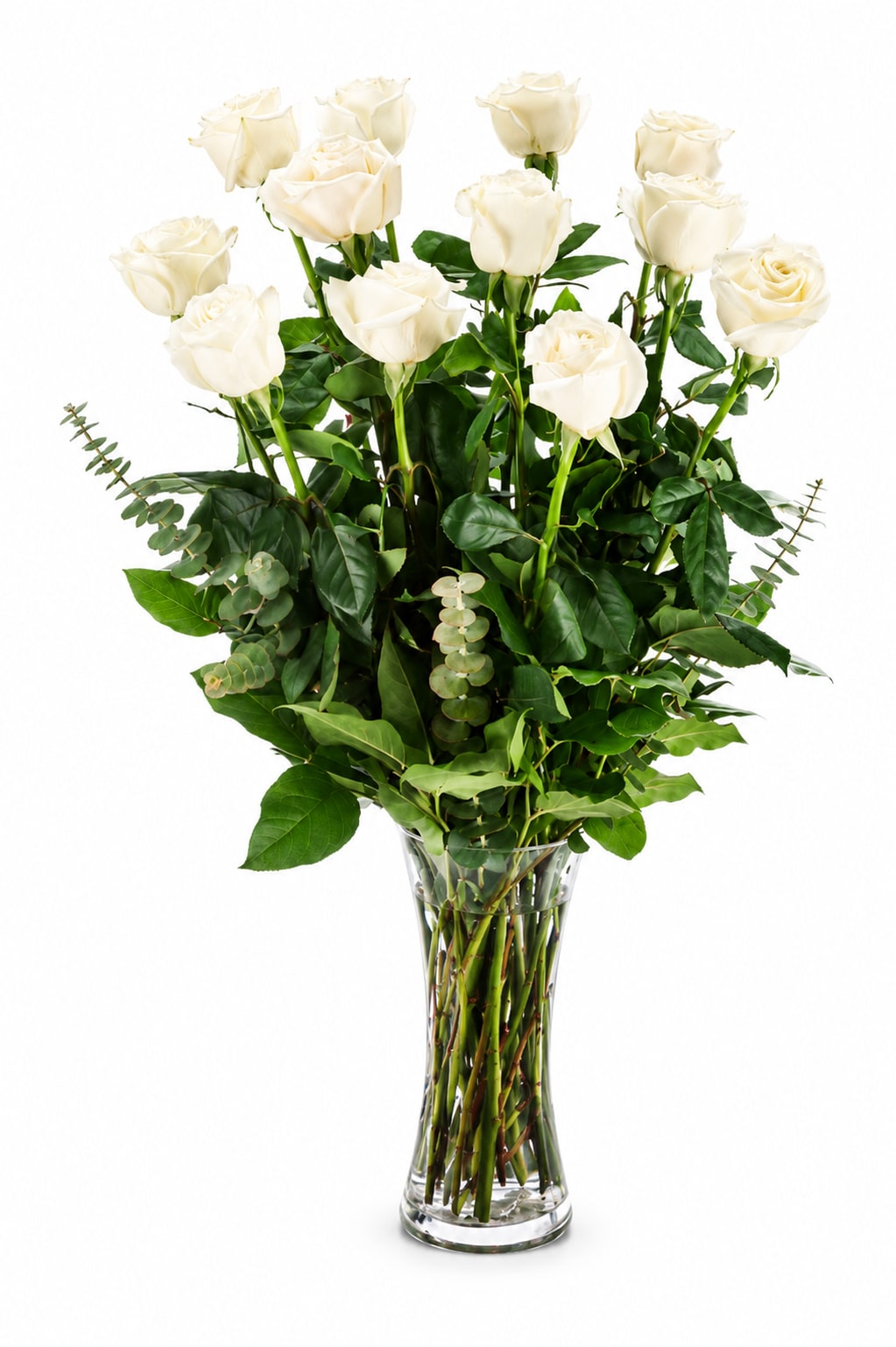 Dozen Long Stemmed White Roses  - Tall, elegant white roses rise above a cloud of rich green foliage in a clear glass vase-this dozen long-stemmed white roses arrangement is the kind of anniversary or wedding gift that reads as quietly luxurious. The clean vertical silhouette and visible stems give a fresh, straightforward look that suits love and romance, holiday gatherings, or a refined statement for Valentine's Day without feeling fussy.  Each bouquet features twelve long-stem white roses paired with dense green greenery arranged in a clear glass vase for a calm white-and-green palette. The airy spacing and height keep the arrangement feeling refined and not overly compact; approximate dimensions are 20" deep by 30" high. It's a tasteful choice for the person you want to make feel truly seen-classic enough for formal events, understated enough for everyday gifting.  Care: keep the vase topped with fresh water, trim stems slightly every few days, and display away from direct heat or drafts to prolong vase life. Order with confidence for anniversaries, weddings, holiday celebrations, or any romantic moment that calls for timeless white roses.
