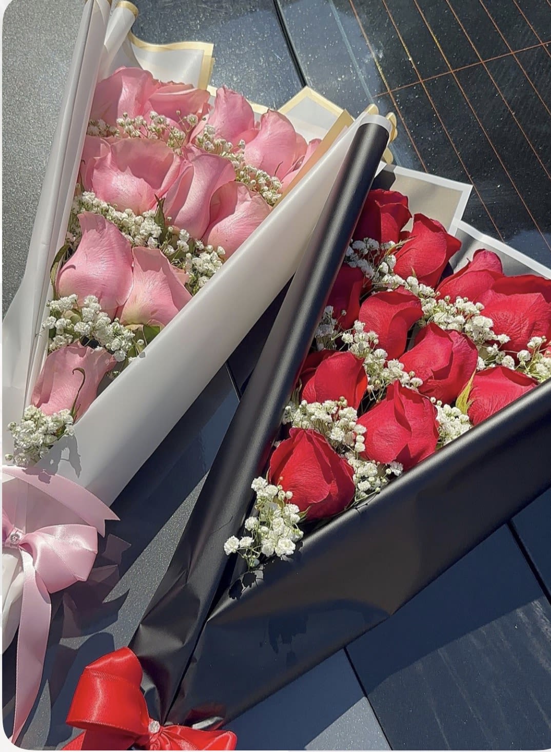 Velvet Roses  - 12 roses layered in pattern with baby breath and greenery wrapped in paper 