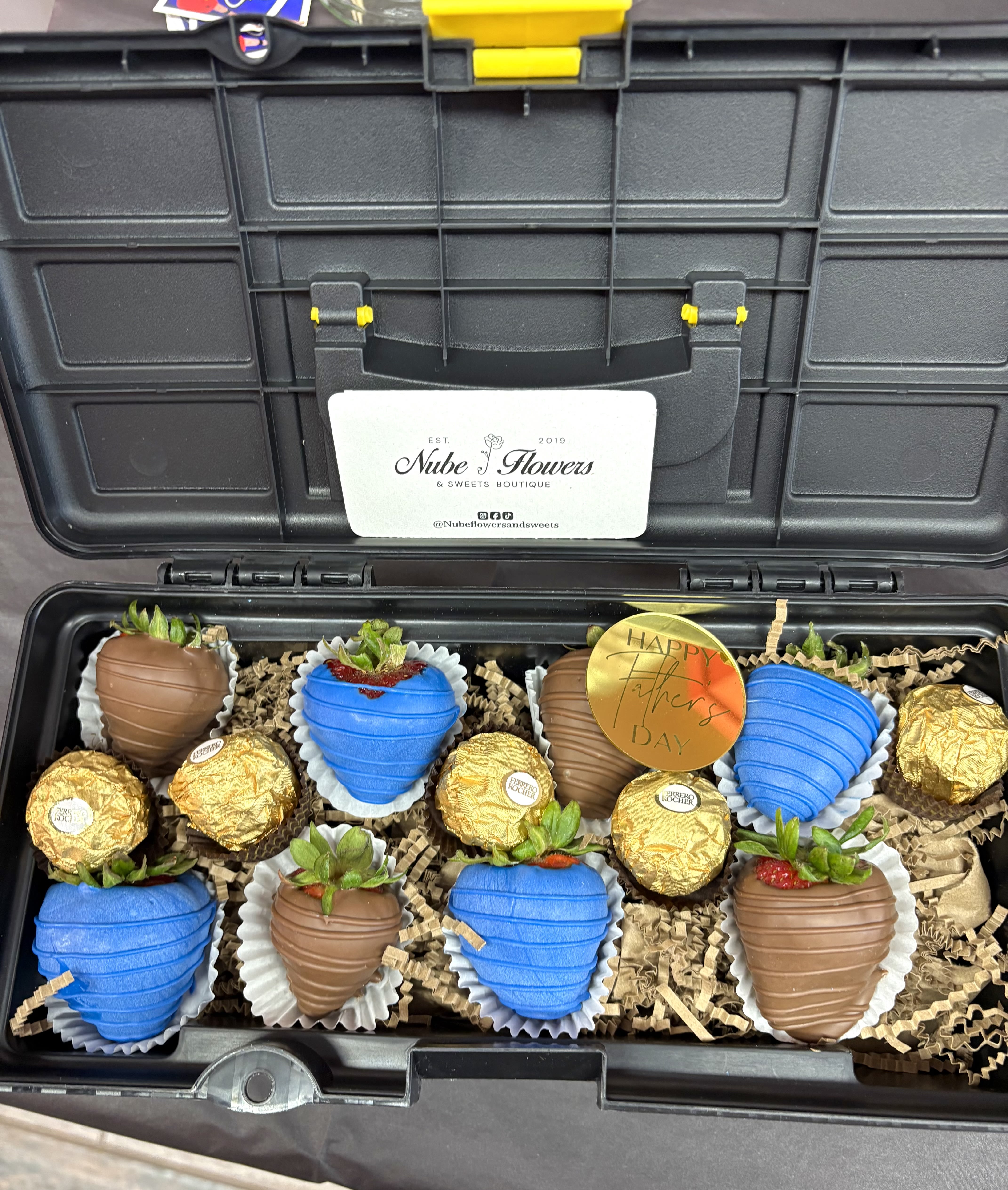Gift box with chocolate-covered strawberries and Ferrero Rocher candies