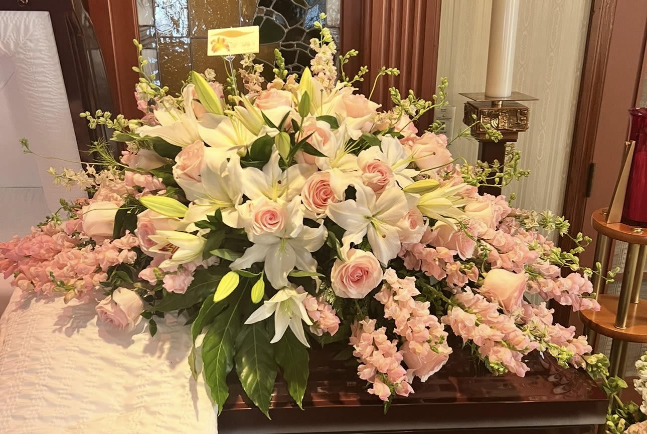 Pink Love - A beautiful full casket arrangement in different tones of pinks and whites 