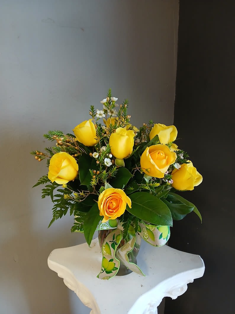*Elevated* Rose Special In a Vase #3 - This fan favorite rose special includes mixed colored (excluding red) local 40 centimeter local roses in a vase. A beautiful way to let someone know you are thinking of them, perfect for any occasion. The life expectancy of this beautiful arrangement is approximately 3-5 days. May be more or less depending on how they are cared for. Color of rose, vase, filler, greens and ribbon will vary, and will not be the same as the picture show.