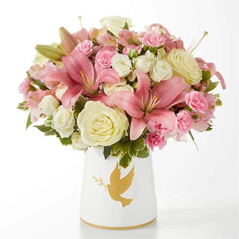 Dove Centerpiece - a thoughtfully curated composition of roses, alstroemeria and mini carnations.
