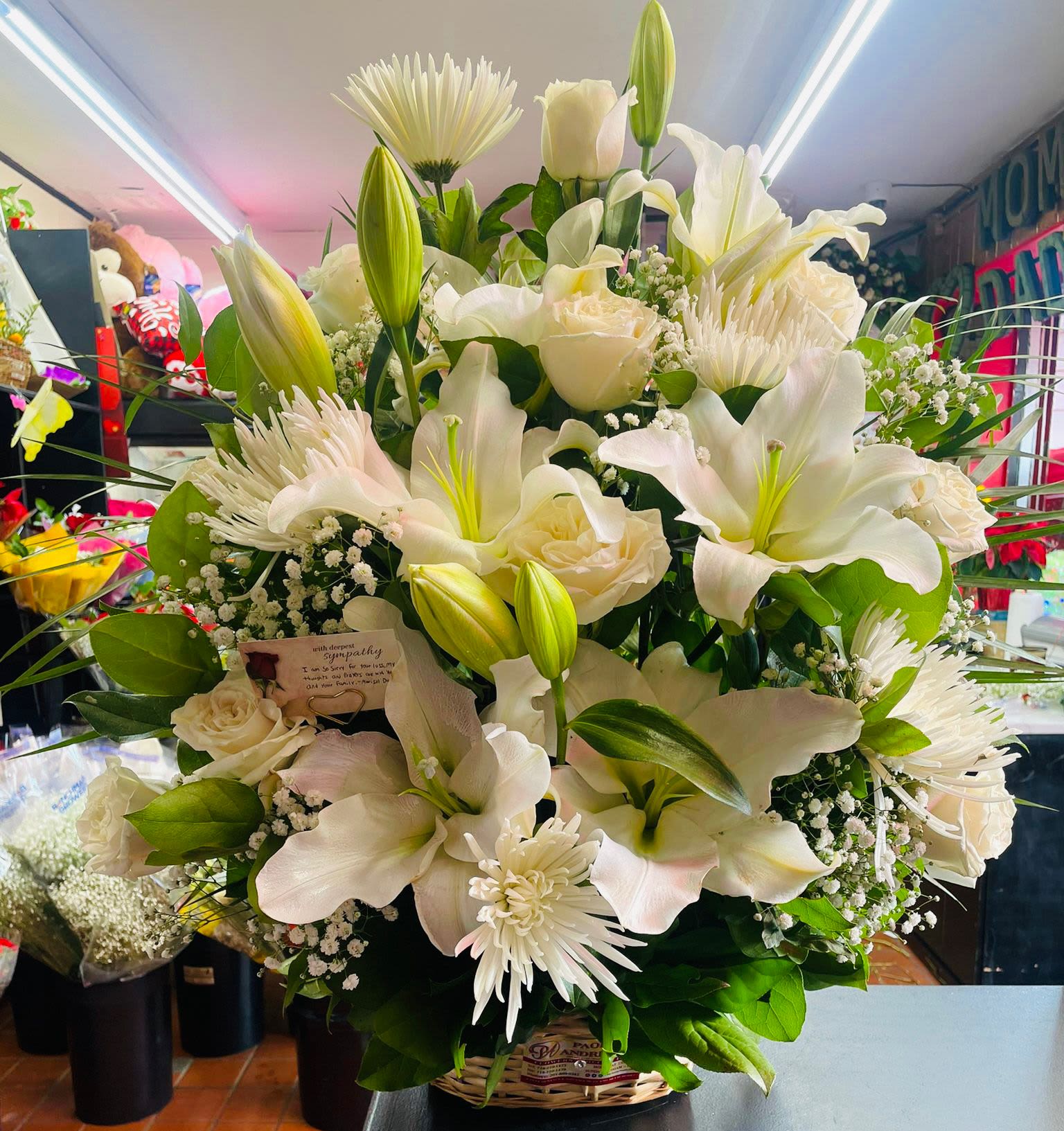 Lilies Sympathy Basket Arrangement - .