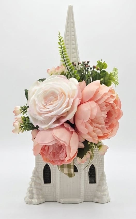 Large Ceramic Lighted Church with Silk Floral Arrangement - Large Ceramic Lighted Church with Stained Glass windows. Comes with a new light cord with inline switch and plays Amazing Grace is 18" Tall to the top of Steeple. Comes adorned with a beautiful silk arrangement in pale pink and pink arranged on a bow. Wonderful sympathy, birthday, get well or just because gift. 
