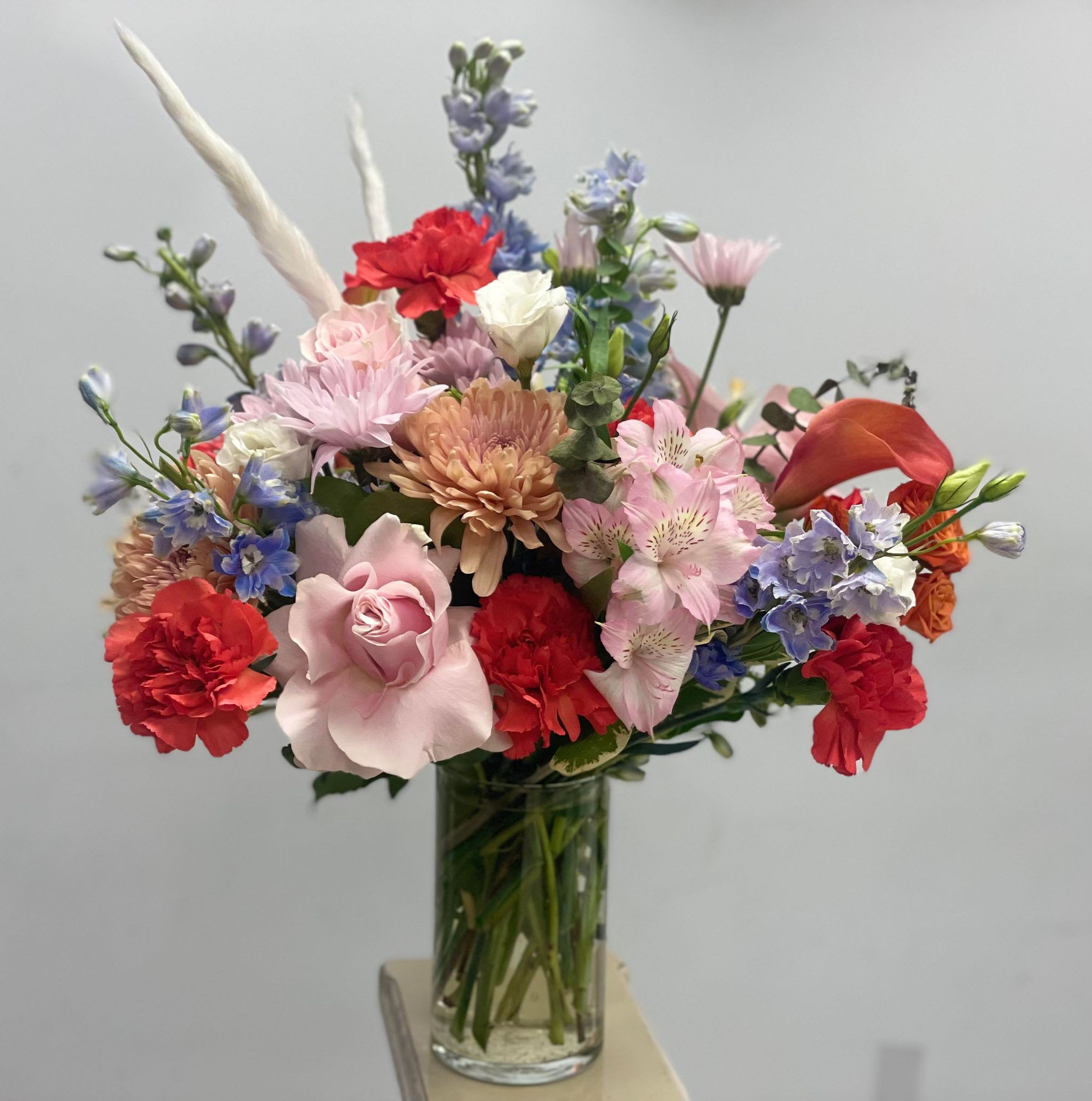 Visual Delight - This new floral vase is a testament to the sheer diversity and enchantment of the natural world, bringing together a spectrum of colors and emotions in one harmonious display. Whether adorning a dining table, brightening a corner of your home, or conveying your warmest wishes, this radiant arrangement is a celebration of life's beauty and the joy it brings. Let it be a reminder that in every bloom, we find a little piece of nature's own magic, captured in a crystal-clear vase.