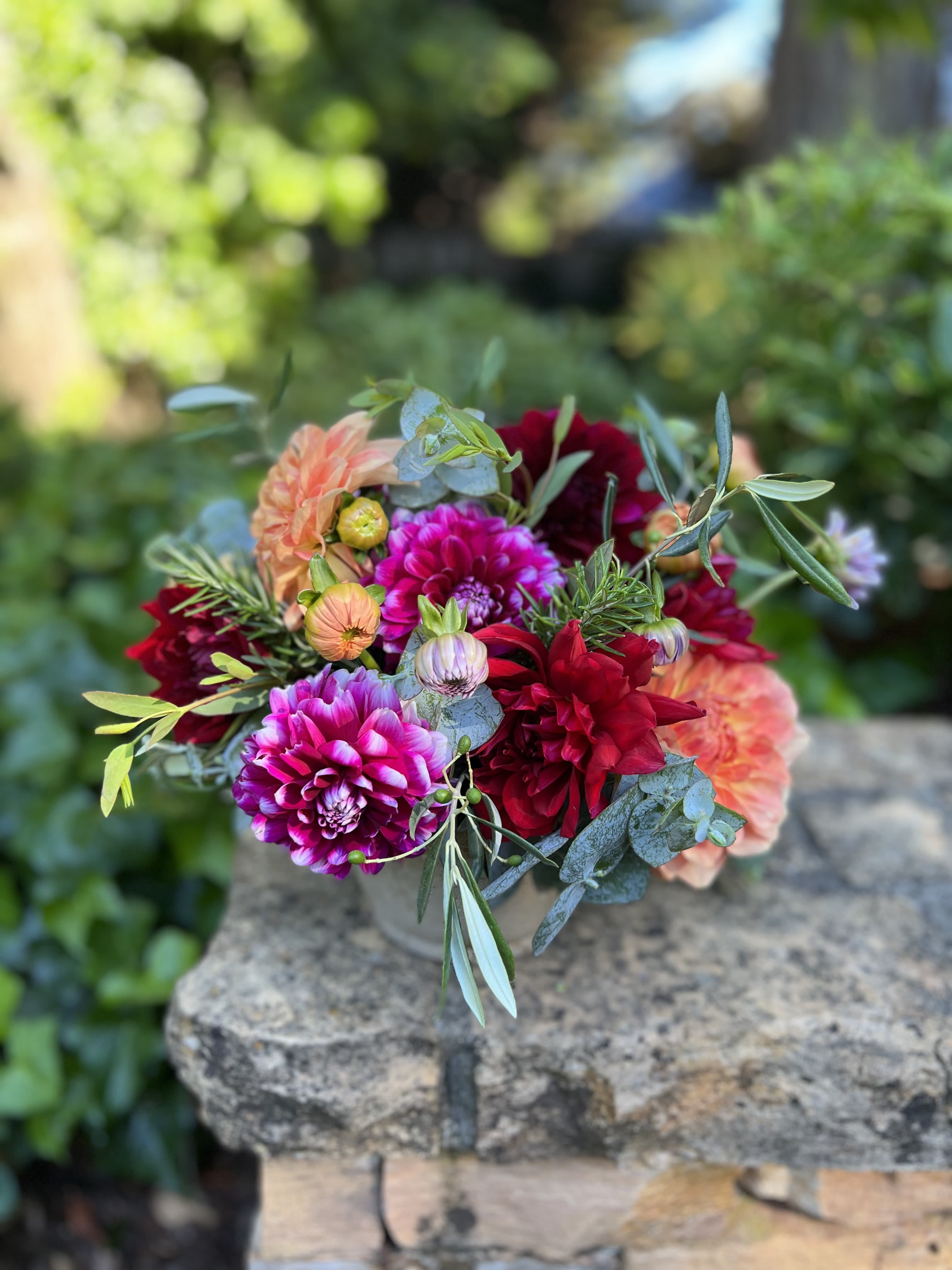 Henry’s Dahlias  - Freshly picked from our farm, enjoy these seasonal beauties now through autumn in bright warm tones in a rustic container. 