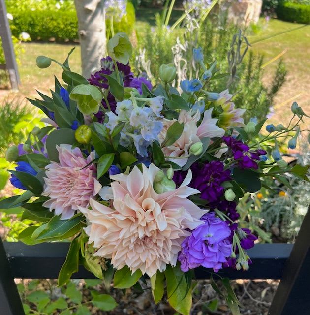 Mixed bouquet with pale pink, purple, blue, and white flowers